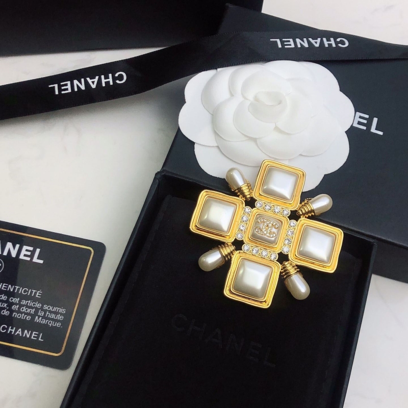 Ch*el brooches